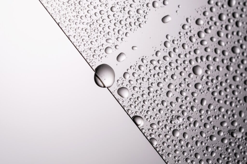 Drops of water on a transparent gray background.