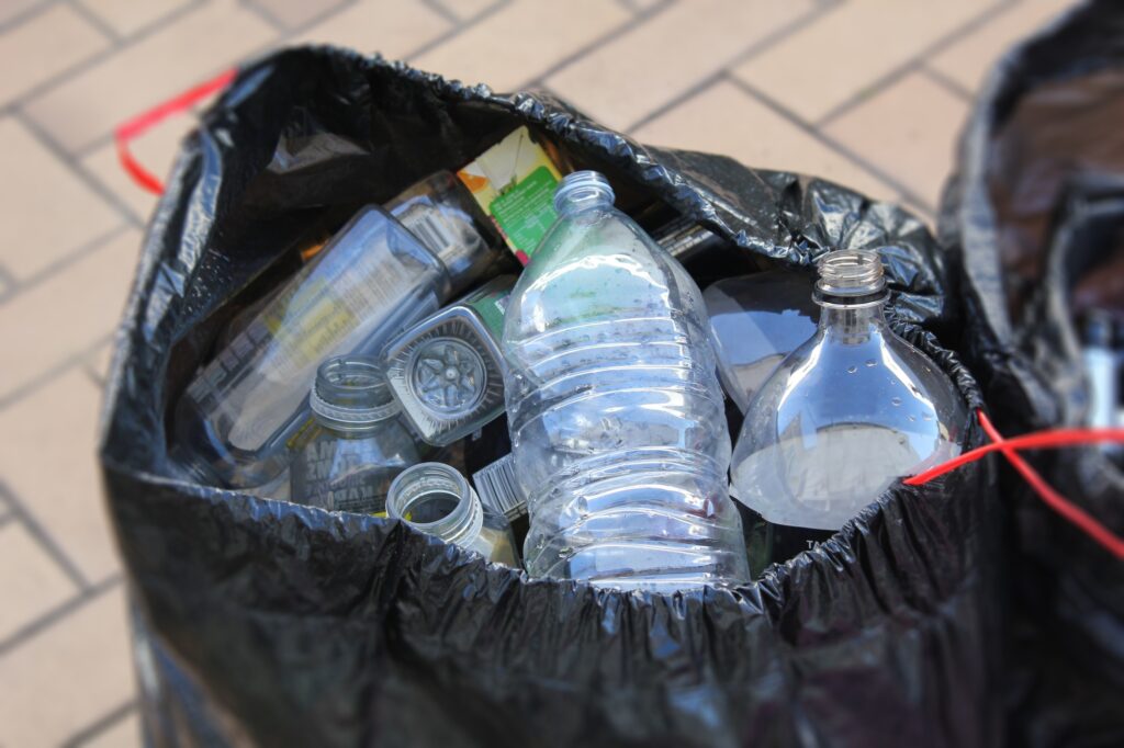 Taking plastic bottles to the recycling center